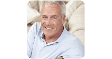 Robert a senior man smiling and sharing his SharpEar experience with better hearing during social gatherings